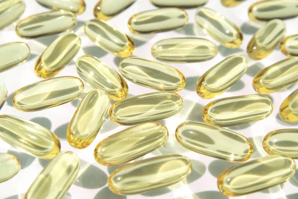 stock image Fish oil softgel capsules. Omega 3 food supplement. Medicines and healthcare