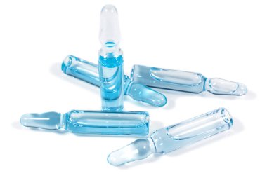 Scattered glass ampoules with light-blue medicine for injection. Immunization and vaccination. Subcutaneous injections and plastic surgeon service. Medicines, pharmacology and healthcare clipart