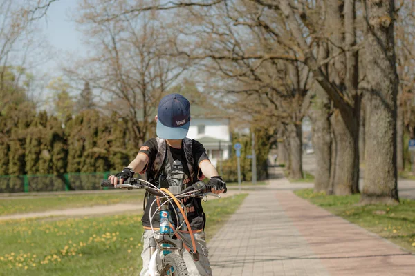 Stock image Opening of the summer season, a child with a bicycle. Sports activity.