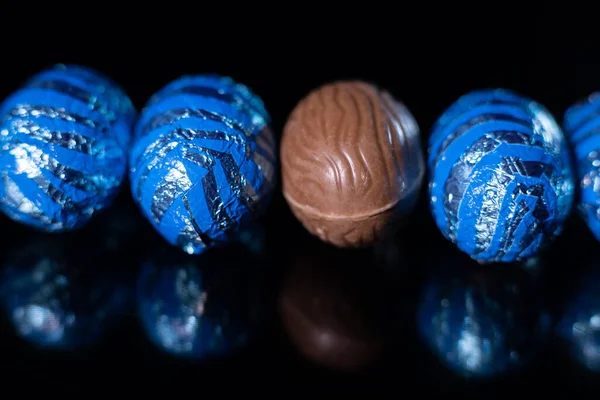 stock image Easter eggs on a black background. Colorful easter eggs background. One chocolate egg.