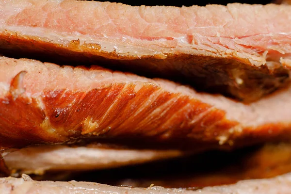 stock image Smoked cooked ribs on a black background.