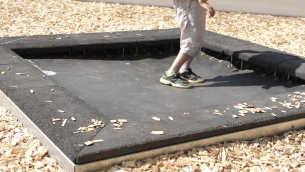 Boy Jumping Trampoline Playground Summer Fun — Stock Video