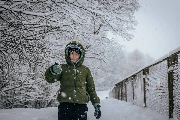 stock image A child in a pile of snow. A person lying in the snow makes a snow angel. A man making a snow angel in a snowy landscape.