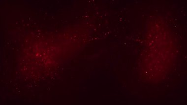 Parlayan kırmızı dalga enerji parçacıklarının soyut arkaplanı. Sihirli toz ve güzel bokeh. Nebula parıldayan noktalar. Kusursuz döngü 