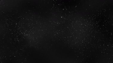 Havada uçuşan gerçek toz parçacıkları. Toz parçacıkları arka planda ve koyu arkaplanda güzel bir bokeh. Yavaş çekim makro çekim. Kusursuz 4k döngü videosu.