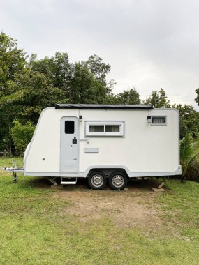 A camper van parking in the garden.