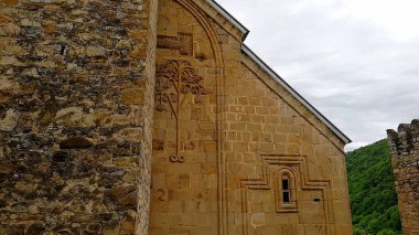 The carved wall reliefs of the church at Ananuri Medieval Fortress clipart