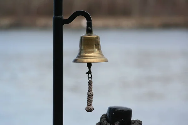 Stock image a closeup shot of a bell with a blurred background