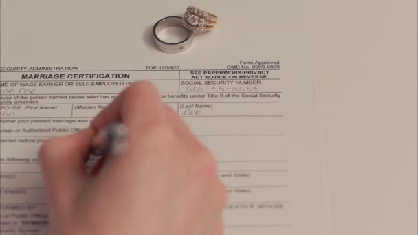 Caucasian Female Hand Filling Out Marriage Certificate Shot Arri Alexa — Stock Video