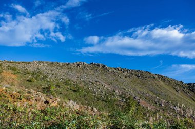 Scenery of rocky mountains at the southern foot of Mt. Kusatsu-Shirane. clipart