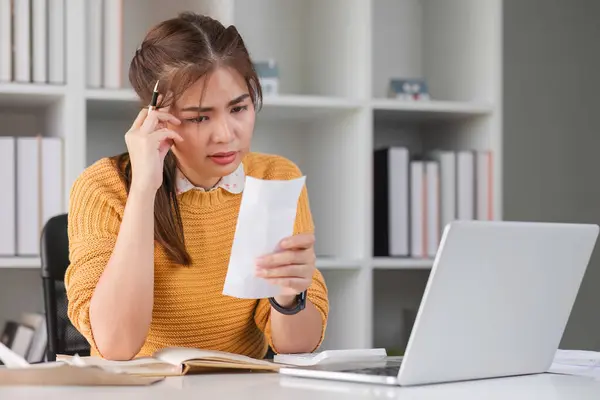 Worried frustrated woman shocked by bad news or rejection reading letter, stressed girl troubled with financial problem, domestic bills or debt.
