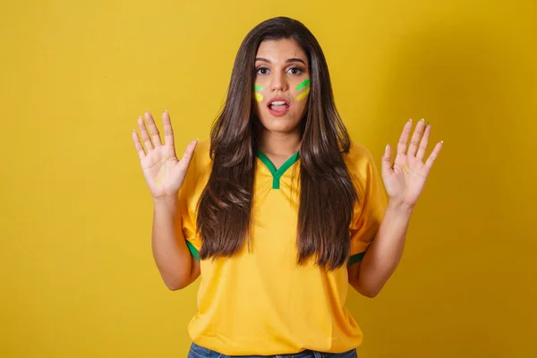 stock image Woman supporter of Brazil, world cup 2022, soccer championship, Surprised with high hands.