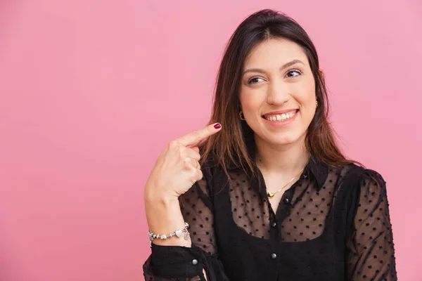 Beautiful Brazilian Caucasian Woman Pink Background Pointing Cheek Smile Concept — стокове фото