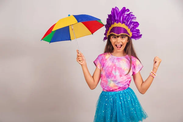 Stock image Beautiful Brazilian girl, child, dressed for carnival in Brazil. dancing with frevo umbrella.