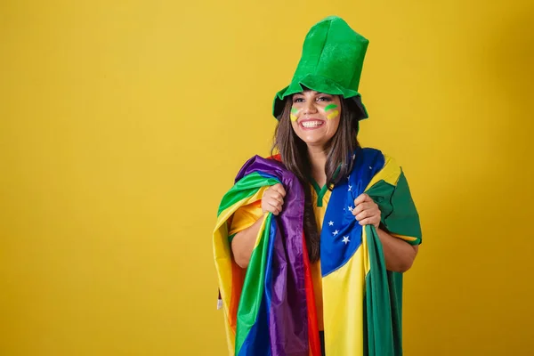 Woman supporter of Brazil, world cup 2022, wearing colorful flag, lgbt, diversity, sexuality.