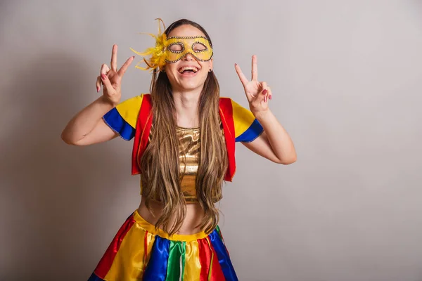 stock image Beautiful Brazilian, Caucasian woman, wearing frevo, carnival clothes, wearing a mask. peace and love.