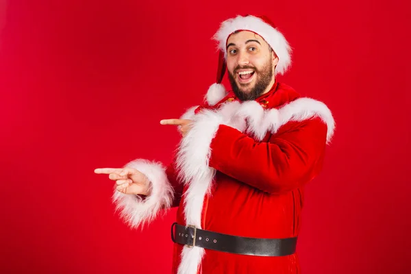Brazilian Man Dressed Santa Claus Clothes Presenting Product Text Left — Stock Photo, Image