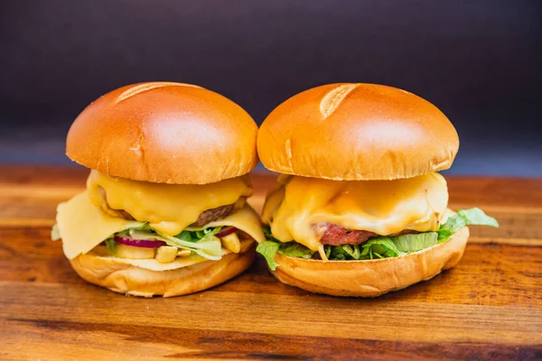 Two Artisanal Burgers Made Roasted Sausage Onion Rings Tomato Onion — Stock Photo, Image