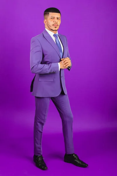 Brazilian black man, dressed in a suit and purple tie. business man. full body photo, violet
