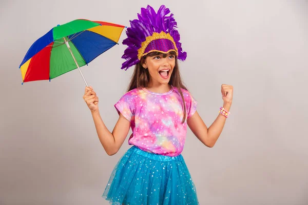 stock image Beautiful Brazilian girl, child, dressed for carnival in Brazil. dancing with frevo umbrella.