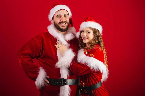 Brazilian Couple Dressed Christmas Clothes Santa Claus Hugging Giving Kiss — Stock Photo, Image