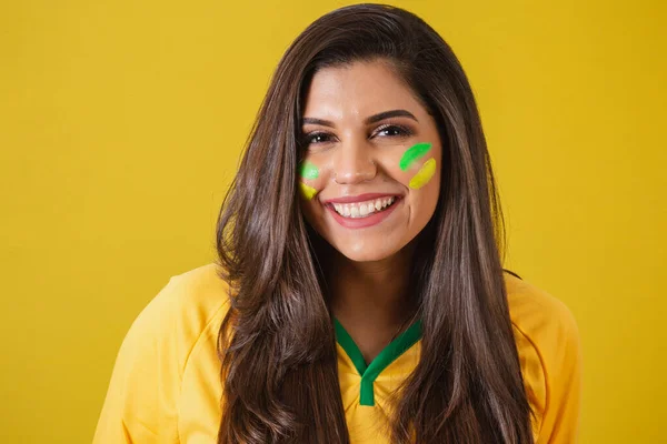 Close-up photo of Woman supporter of Brazil, world cup 2022, soccer championship, smiling.