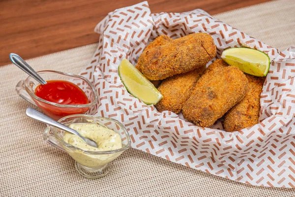 Chicken Croquette Served Lemon Slices Chili Sauce Mayonnaise White Tablecloth — Stock Photo, Image