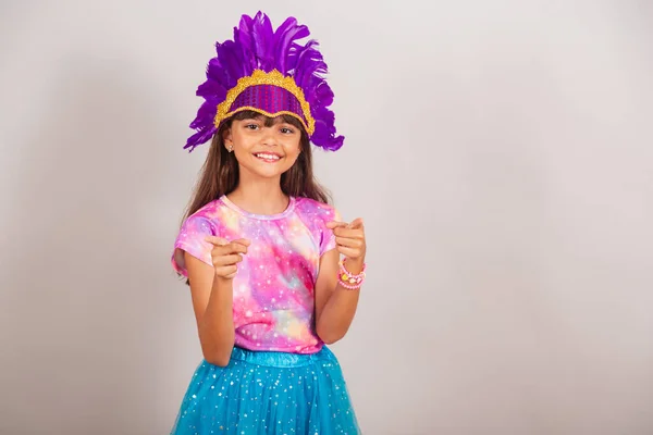 stock image Beautiful Brazilian girl, child, dressed for carnival in Brazil. pointing at camera, choosing you.