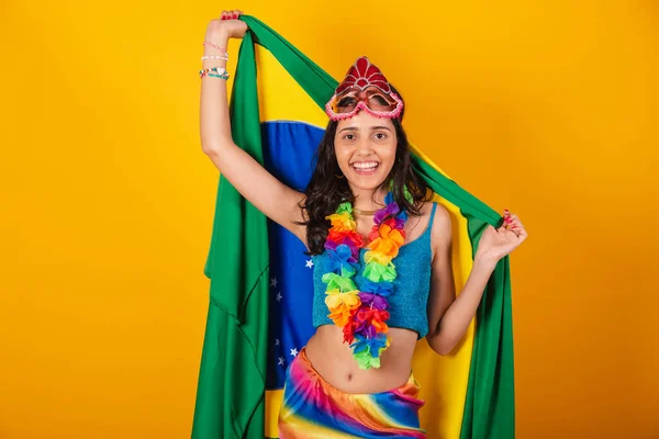 Stock image beautiful brazilian woman in carnival clothes, with flag of brazil.