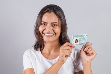 Brazilian woman, with driver's license, license to drive. Brazilian document. clipart