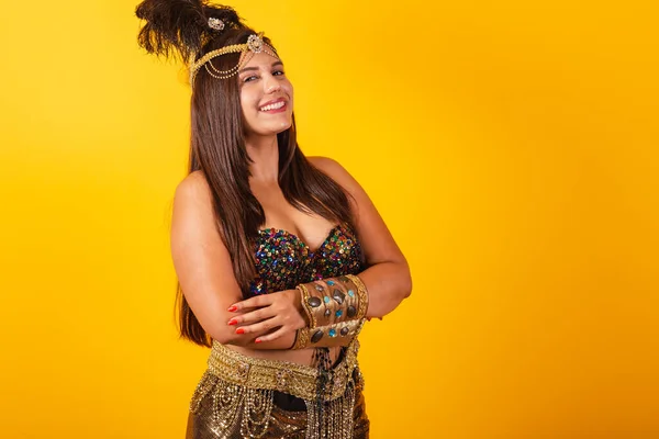 stock image Beautiful Brazilian woman in carnival clothes, arms crossed, smiles