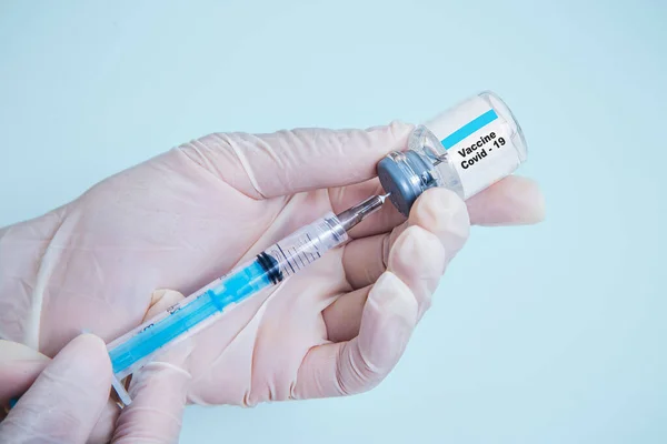 Vaccination against the new Corona Virus Vacine-Covid19: A syringe being drawn up with Vacine-Covid 19.