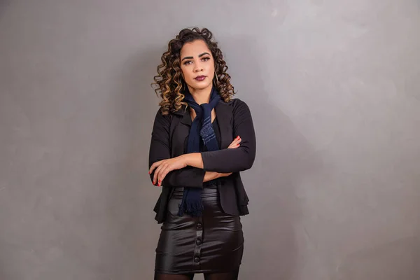 Stock image beautiful afro business woman with arms crossed.