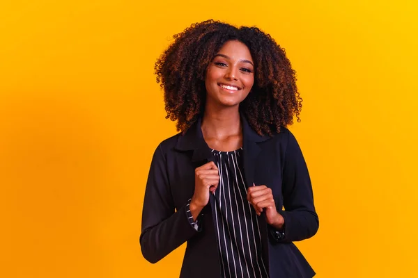 afro woman with curly hair on yellow background