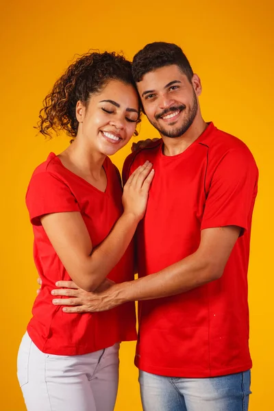 Portrait Content Couple Basic Clothing Smiling Camera While Woman Putting — Stock Photo, Image