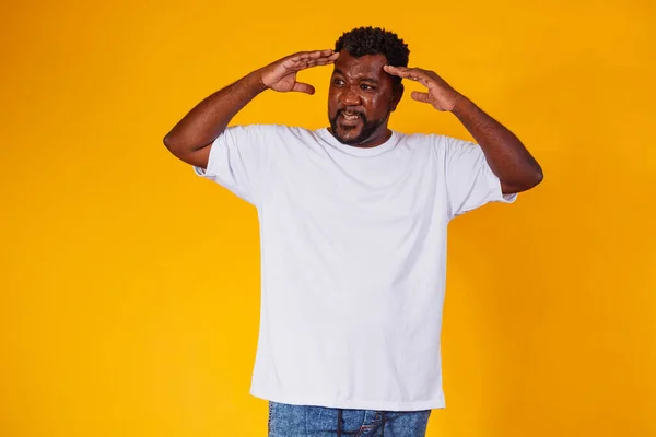 afro man forgotten and confused on yellow background