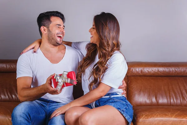 Smiling Man Surprises His Girlfriend Present Home — Stock Photo, Image