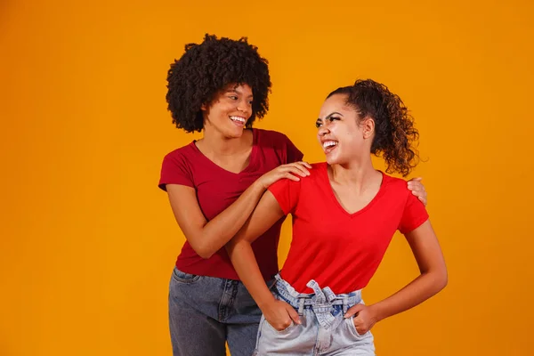 stock image Young beautiful and happy afro female friends smiling to the camera.