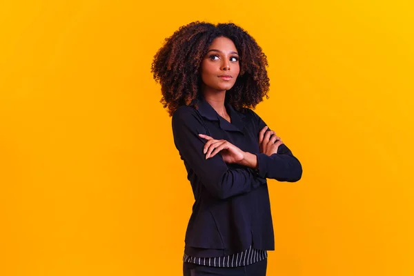 stock image afro woman in pantsuit. Successful black woman, business woman.