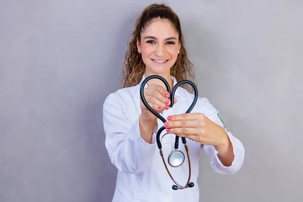 Photo Nurse Holding Stethoscope Gray Background — Zdjęcie stockowe