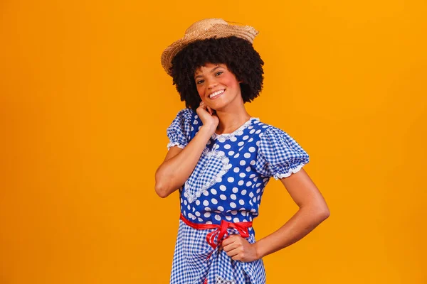 stock image Brazilian afro woman wearing typical clothes for the Festa Junina in yellow background