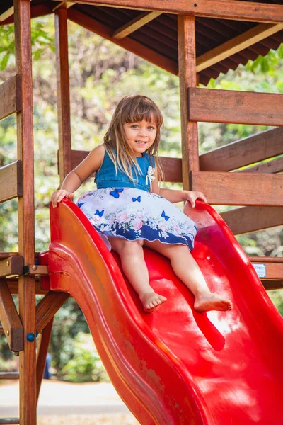 stock image beautiful caucasian girl child playing on the playground.