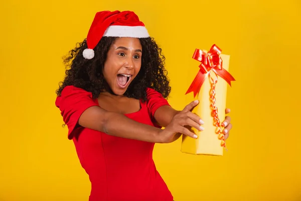 Young Afro Girl Holding Expressive Christmas Present — Stock Photo, Image