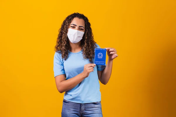 Afro Woman Surgical Mask Holding Brazilian Work Card Yellow Background — Stock Photo, Image