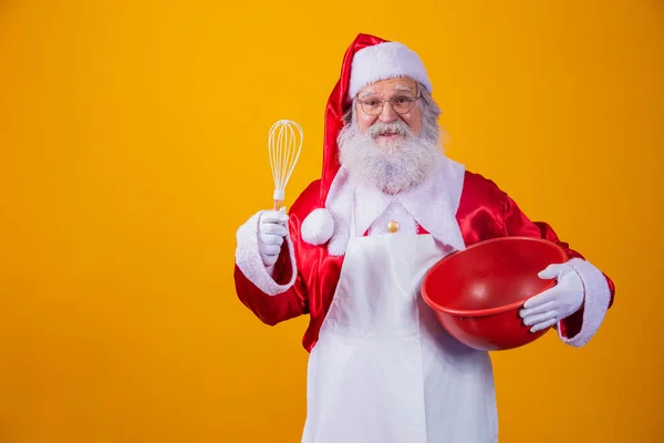 Santa Claus Bowl Beating Cake Yellow Background — Stock Photo, Image