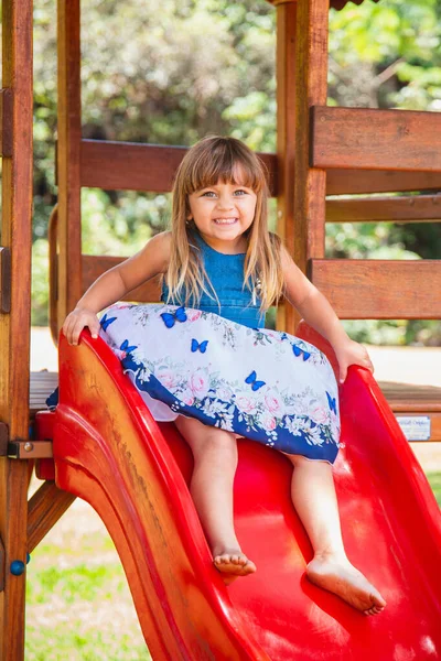 stock image beautiful caucasian girl child playing on the playground.