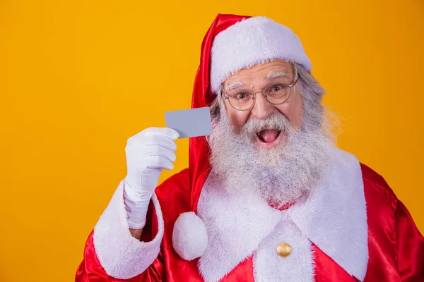 Photo Santa Claus Holding Credit Card Yellow Background Easy Payment — Stock Photo, Image
