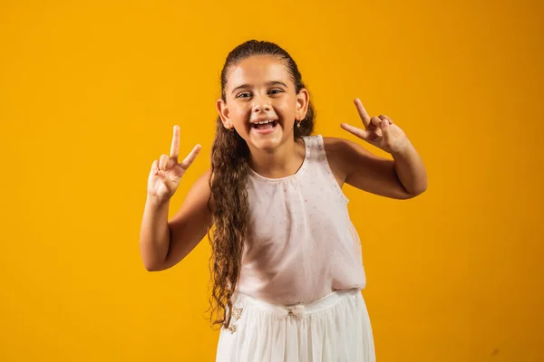 Adorable Little Girl Making Sign Yellow Background Good Vibe Peace — Stock Photo, Image