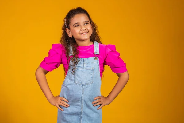 stock image photo of beautiful mixed girl smiling looking at camera. Children's Day