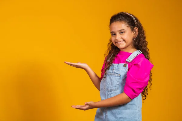 Positive Beautiful Mixed Little Girl Yellow Background Beaming Smile Pointing — Stock Photo, Image
